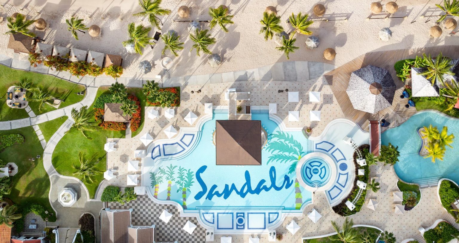 Aerial view of the main pool and beach at Sandals St. Lucia Grand Bay, formerly Sandals Grande St. Lucian
